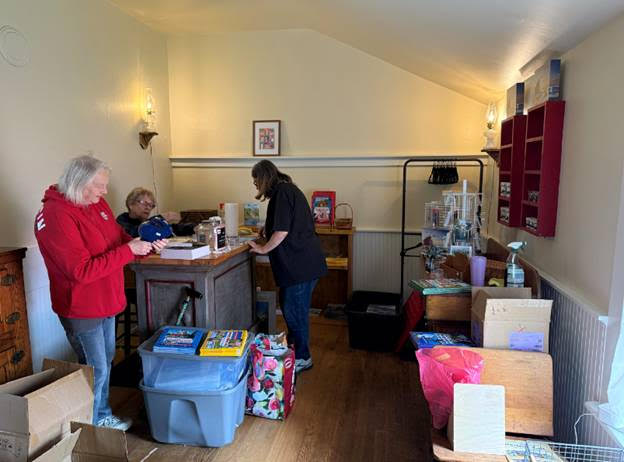 05.20.2025 06 Mary Ann and Wendy setting up the gift shop